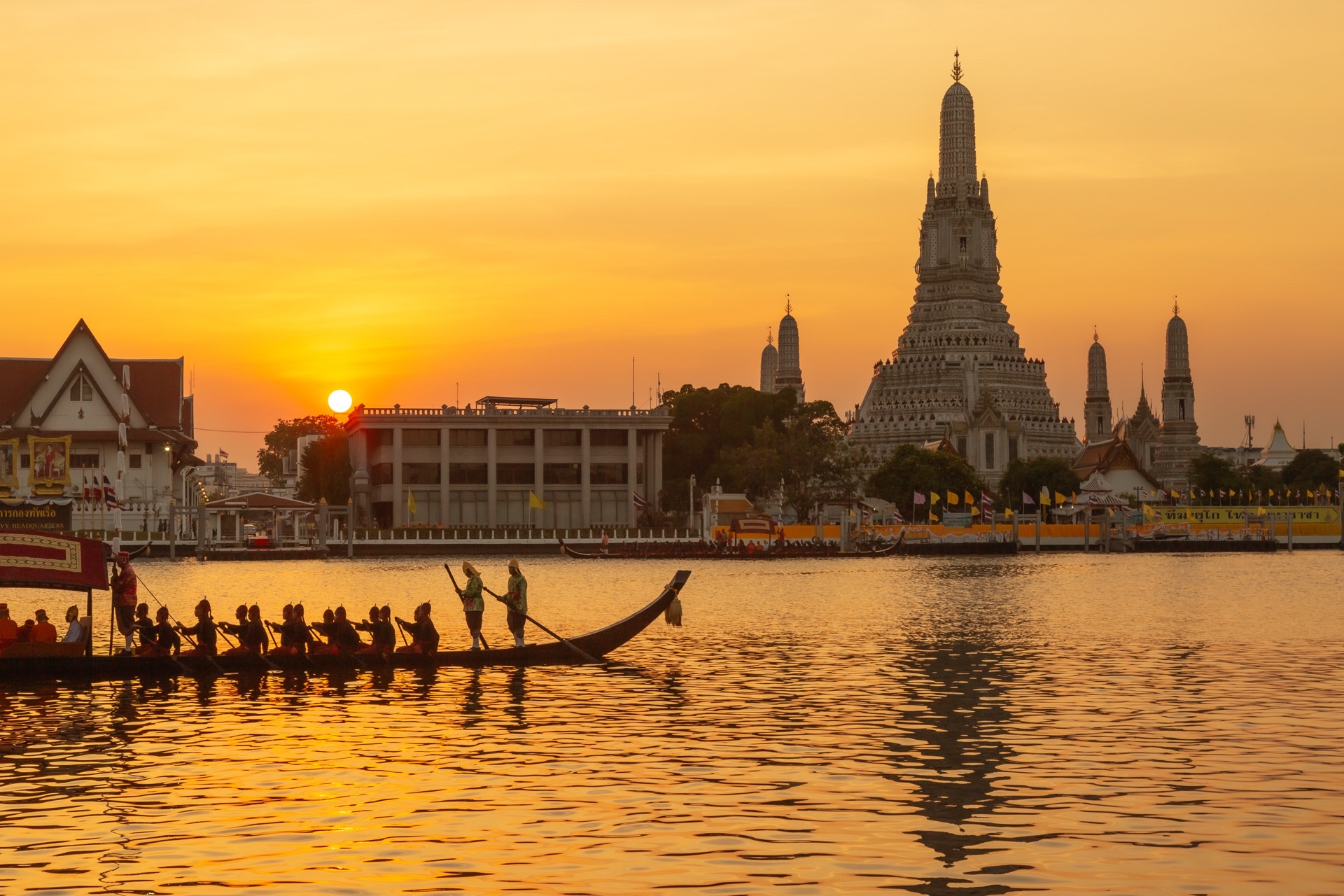 Wat Arun along the Chao Phraya River in Bangkok at dawn
