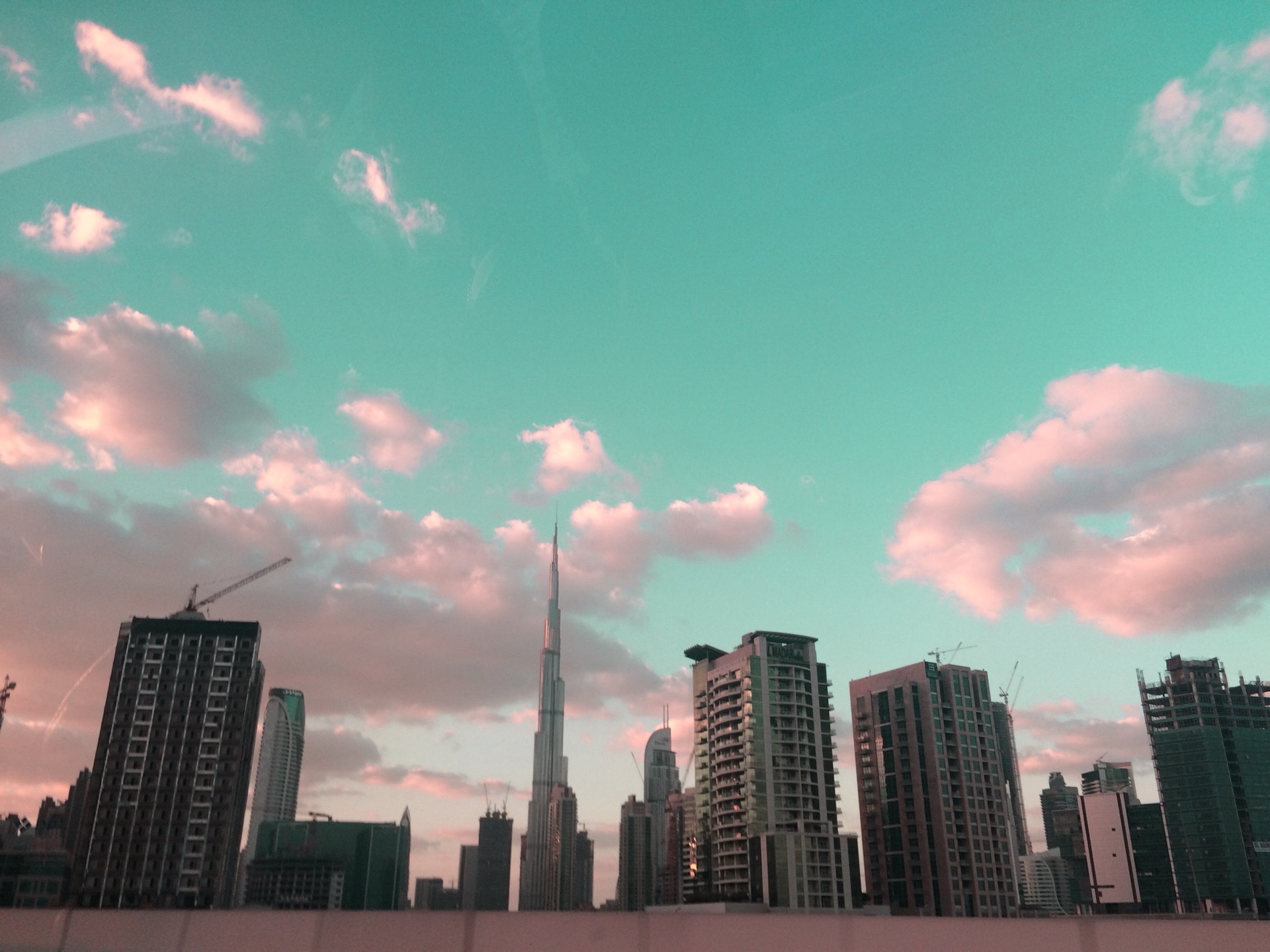 Burj Khalifa rising above Downtown Dubai skyline and modern avenues