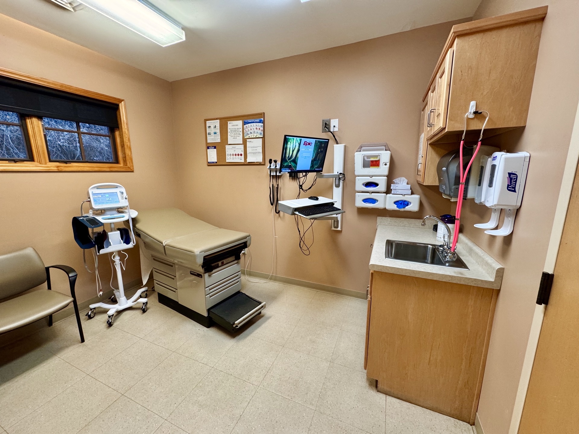Doctor consulting with patient in modern private medical clinic
