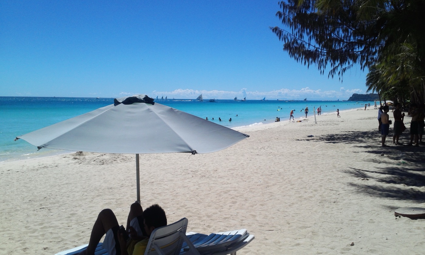 White Beach Boracay with turquoise water and palm trees