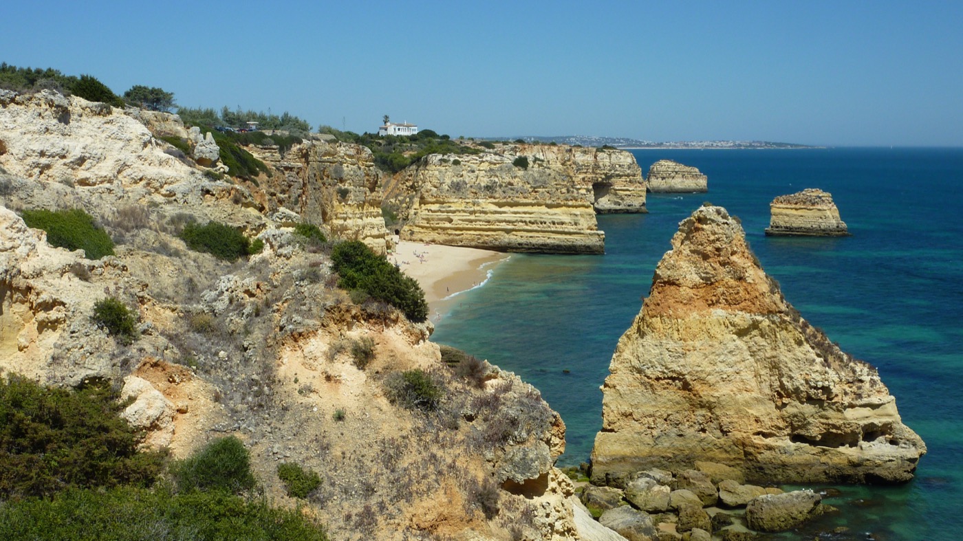 Praia da Marinha with iconic golden cliffs and turquoise ocean in Algarve Portugal